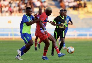 WINDHOEK, 19 October 2024 - Eeshoke Chula-Chula player Uugwanga Vaino (in lime green) and African Stars player while in action during the Dr Hage Geingob Cup Cup final at the Independence Stadium. (Photo by: Hesron Kapanga) NAMPA