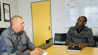 WALVIS BAY, 01 November 2024 - Fisheries and Marine Resources Minister Derek Klazen talking to Chaiperson of the Okapale Fishermen Group Godfried Kuhanga during consultations with fishermen representatives at Walvis Bay. (Photo by: Isabel Bento) NAMPA