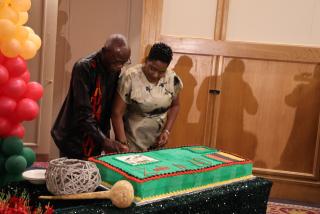 WINDHOEK, 02 October 2024 - Ambassador Stephen Katuka celebrates his country's independence by cutting a cake with Deputy Minister Emma Kantema-Goamas. (Photo: Andreas Thomas) NAMPA

