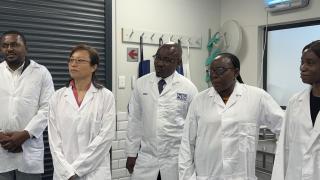 WALVIS BAY, 19 November 2024 - National Standards Institution Chief Executive Officer Eino Mvula' Food and Agriculture Organisation Representative in Namibia Qingyun Diao; Health Director in the Erongo Region Dr Anna Jonas, among others, observing laboratory proceedings during a visit to the Namibia Standards Institute’s (NSI) newly established Import Inspection Project at Walvis Bay. (Photo by: Isabel Bento) NAMPA