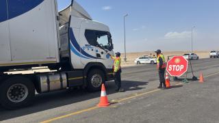 SWAKOPMUND, 11 December 2024 - Law enforcement officers in the Erongo Region checking vehicles at a checkpoint as part of the festive season safety campaign. The campaign which commenced on 15 November 2024 and will run until 17 January 2025 will focus on loads on vehicles, execution of warrant of arrest, roadworthiness of motor vehicles, among others. (Photo by: Isabel Bento) NAMPA