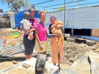 WINDHOEK, 06 JAN (NAMPA)- Elizabeth Goliath (center) and her family, some of the Otjomuise flood victims. (Photo by: Eba Kandovazu) 