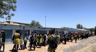 WINDHOEK, 13 January 2025- Cuba Primary School learners waiting infront of Dr Abraham Iyambo Primary School to start the academic year as they share school infrastructure while waiting for the completion of their school. (Photo by: Linea Dishena) NAMPA 