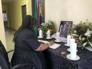 NKURENKURU, 17 February 2025- The Governor of Kavango West Region, Sirkka Ausiku signing the book of condolences during the candle lighting ceremony in honour of the Founding President Sam Nujoma. (Photo by: Lylie Joel) NAMPA