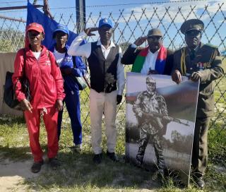 ONDANGWA, 20 February 2025 - PLAN Combatants saluting Founding President Sam Nujoma as they wait for his remains to arrive at the Andimba Toivo Ya Toivo Airport in Ondangwa. (Photo by: Clarence Katjaita) NAMPA 