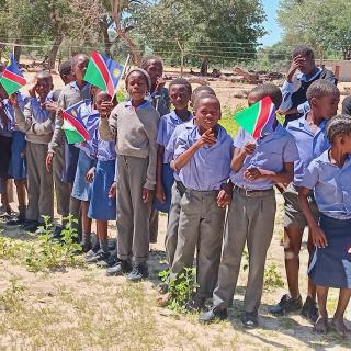 Eenhana, 21 February 2025 - Learners of the David Shingo Combined School line up along the road to see the casket carrying the late Founding President Sam Nujoma. (Photo: Clarence Katjaita) NAMPA 