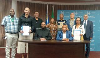 MARIENTAL, 25 February 2025 - Hardap Governor Salomon April; Hyphen Hydrogen Energy's Head of Environment and Social Governance, Toni Beukes and Acting Chief Regional Officer (CRO) Sima Luipert pictured with local councillors at the signing of the MoU between Hyphen Hydrogen Energy and the Hardap Regional Council on Tuesday.