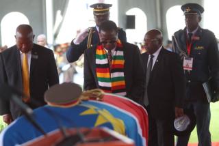 WINDHOEK, 28 February 2025 - Zimbabwean President Emmerson Mnangagwa pays homage to Namibia's Founding President Sam Nujoma. (Photo by: Hesron Kapanga) NAMPA