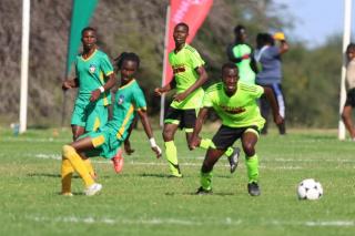 OUTJO, 20 April 2025 - Omaheke's Under-20 football team (yellow and green kits) in action against Kavango West. (Photo: Contributed) NAMPA 