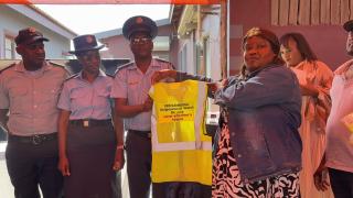 SWAKOPMUND, 10 May 2025 - Commander of the Mondesa Police Station, Ulrich Beukes, receiving a donation of reflector jackets for the neighborhood watch. (Photo by: Isabel Bento) NAMPA