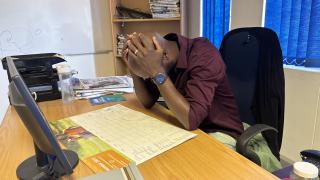 SWAKOPMUND, 14 MAY 2025 - An illustration photo of a civil servant overwhelmed by stress and emotional fatigue at work. (Photo by: Isabel Bento) NAMPA