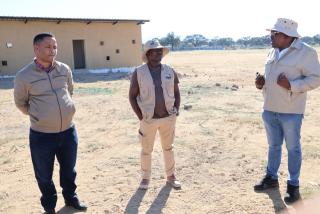 WINDHOEK, 14 May 2025 - Windhoek Rural Councillor Piet Adams (left) pictured with Khomas Regional Council Chairperson John Moonde and Chief Regional Officer Clement Mafwila during the visit to Groot Aub sports filed (Photo: Andreas Thomas) NAMPA