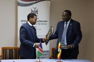 WINDHOEK, 03 June 2025 - Chief Justice Peter Shivute and Ugandan Chief Justice Alfonse Chigamoy Owiny-Dollo during the signing of MoU (Photo: Andreas Thomas) NAMPA

