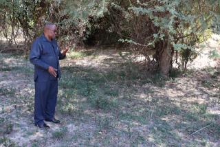 KATIMA MULILO, 22 August 2025 - Former Zambezi Region Governor, Lawrence Sampofu points out where the first commander of the People's Liberation Army of Namibia (PLAN) Tobias Hainyeko was shot and killed on 18 May 1967 at Katima Mulilo near Namwi Island. (Photo by: Mulisa Simiyasa) NAMPA
