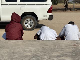 RUNDU, 01 September 2025 - A few of the learners from Maria Mwengere Secondary School seen sitting outside as they are feeling unwell waiting for the bus. (Photo by: Sawi Hausiku) NAMPA 