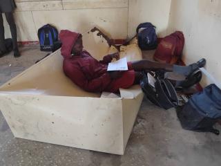 RUNDU, 09 October 2025 - A learner at Katjinakatji Senior Secondary School sitting on an old cupboard. The school lacks desks and chairs. (Photo: Contributed)