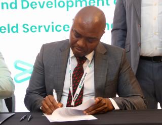 WINDHOEK, 16 October 2025 - Victor Joseph, BH Namibia Country Director while signing the MoU during the Baker Hughes suppliers day which was held in Windhoek. (Phpto by: Hesron Kapanga) NAMPA 