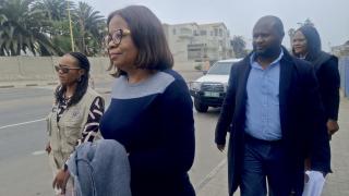 SWAKOPMUND, 05 November 2025 - Deputy Director  in the Ministry of Arts, Youth, Sports and Culture (MEYSAC) in the Erongo Region Natalia Guriras being escorted out of the regional council after she was arrested by the Anti-Corruption Commission for alleged fraud. (Photo contributed)