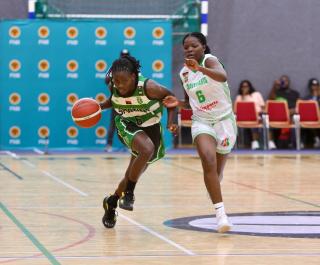WINDHOEK, 08 November 2025 - Mwayiwathu Kadammanja (in white) of Brave Hearts from Malawi while in action against Magda Mussol of Sporting Club de Luanda at the Deutsche Höhere Privatschule (DHPS) Indoor Court in Windhoek against Sporting Club Luanda during the International Basketball Federation (FIBA) Women’s Basketball League Africa (WBLA) in the Southern Africa region. (Photo by: Hesron Kapanga) NAMPA
