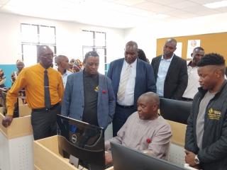 MASOKOTWANI, 10 November – B2Gold Namibia on Monday officially pledged 40 computers valued at N. dollar 250 000 to the Masokotwani combined school in the Zambezi region.
Urban and Rural Development Minister, James Sankwasa who facilitated the donation seats on one of the computer desks to operate the computer.
(Photo: Michael Mutonga Liswaniso) NAMPA
