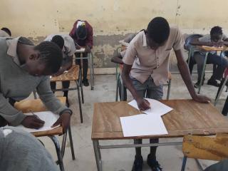 KATJINAKATJI, 13 November 2025- Some grade 8 learners at Katjinakatji Senior Secondary School writing final exams standing due to a severe lack of chairs and desks. (Photo: Contributed) 