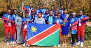 TOKYO, 19  November 2025 - Deputy Head of Mission at the Embassy of Namibia in Japan, Rebecca Iyambo (centre) pictured with Namibia's deaflympians and technical members and coaches, as well as employees of the embassy at the Komazawa Olympic Park General Sports Ground Athletic Field training ground. (Photo by: Hesron Kapanga) NAMPA 