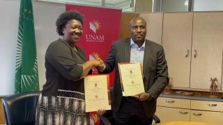 WINDHOEK, 09 December 2025 - Ndiyakupi Nghituwamata, the Executive Director of the Ministry of Agriculture, Fisheries, Water and Land Reform, and Kenneth Matengu, the vice-chancellor of UNAM, on Tuesday signed a Memorandum of Understanding to promote collaboration in research and capacity development in agriculture on behalf of their respective institutions. (Photo: Contributed) NAMPA.