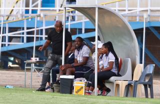 WINDHOEK, 13 December 2025 - UNAM Football Club head coach Robert Nauseb (left) and assistant coach Willem Mwedihanga during Round 12 of the Namibia Premier Football League match against African Stars at the UNAM Stadium. The game ended 1-1 extending UNAM's unbeaten run to 12 matches during the 2025/26 Premier League  Season. (Photo by: Hesron Kapanga) NAMPA