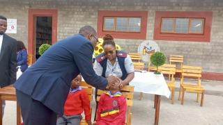 SWAKOPMUND, 27 January 2026 - Swakopmund Constituency Councillor Victor Maswahu administering polio vaccination drops to a child at the Hanganeni Primary School during the launch of the campaign. (Photo contributed) NAMPA