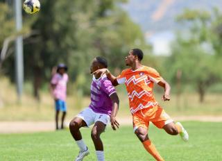 WINDHOEK, 31 January 2026 - Otjiwarongo-based Namibia Premier Football League outfit Life Fighters’ Tjipenandjambi Tjaverua (left) dribbles against FC Ongos defender Hamidu Yakubu during round 14 of the 2025/26 season at UNAM Stadium. Ongos won the match 3-0. (Photo by: Hesron Kapanga) NAMPA