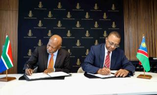 WINDHOEK, 03 MARCH 2026 - Bank of Namibia's Governor Ebson Uanguta and African Reserve Bank (SARB) Governor Lesetja Kganyago signing a Memorandum of Understanding (MoU) to strengthen cross-border cooperation and financial stability in Pretoria. (Photo: Contributed) NAMPA