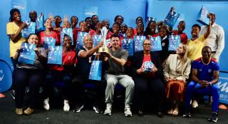 05 March 2026 - The senior national women’s football team, the Brave Gladiators, poses for a photo with MTC MTC’s Chief Brand, Marketing, Communications and Sustainability Officer, Tim Ekandjo (seated in blue) and Deputy Minister of Education Inovation, Youth, Sport, Arts  and Culture, Dino Balloti. The team received N.dollars 300,000 following their historic triumph at the Hollywoodbets COSAFA Women's Championship that was played in South Africa. (Photo by: Hesron Kapanga) NAMPA