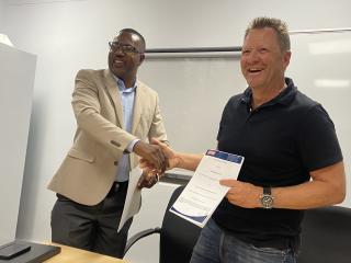 WINDHOEK, 19 March 2025 - Namibian Food and Allied Workers Union (NAFAU) Deputy General Secretary, Willem Absalom pictured with Bokomo Namibia Chief Executive Officer, Hubertus Hamm, after signing the wage agreement. (Photo by: Edward Tenete) NAMPA