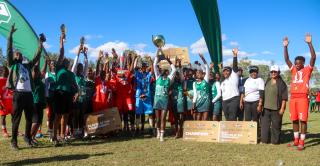 KEETMANSHOOP, 06 April 2026 - The Erongo Region's Under-20 football team and Kavango East netball team pictured after being crowned winners of the 2026 Nedbank Namibian Newspaper Cup at the Westdene Stadium in Keetmanshoop. Erongo won the match 2-1 against Kunene while Kavango defeated Khomas 35-28. (Photo by: Hesron Kapanga) NAMPA