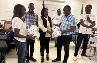OMUTHIYA, 09 APRIL 2026- Oshikoto education director Hilma Nuunyango George (C) receiving soccer balls for the 44 schools in the region that have embraced the FIFA Football for Schools programme.

(Photo: Max Henrich) NAMPA