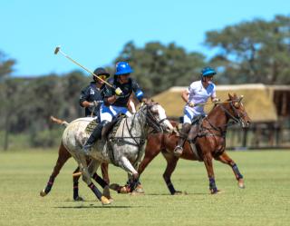 WINDHOEK, 18 April 2026 - Mariano Mazzitelli (in black) of La Muela Polo Club while in action against Jony Aboytie (in white) of Maranatha Polo Club during the country’s first-ever polo exhibition match at Farm Gocheganas, just outside Windhoek. La Muela Polo Club won the match 7-5. (Photo by: Hesron Kapanga) NAMPA