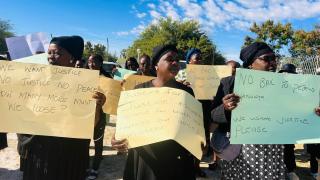 OSHAKATI, 20 April 2026- Family members of the late Ondangwa prosecutor Justine Shiweda hold up her posters during a peaceful demonstration in Ondangwa on Monday, where they handed over a petition opposing bail for the accused in her murder. (photo: contributed) 