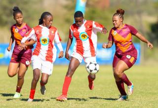 WINDHOEK, 16 May 2026 - A UNAM Bokkies player (in red and white) battles for possession against Ongos FC (in maroon) during Round 20 of the Women’s Super League at UNAM Stadium in Windhoek. The closely contested encounter on Saturday ended in a goalless draw. (Photo by: Hesron Kapanga) NAMPA