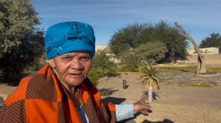 BETHANIE, 24 May 2026 - The 86-year-old Anna Frederick, widow of the late !Aman chief Dawid Frederick, stands a few feet away from the hanging tree in Bethanie. (Photo by: Sawi Hausiku) NAMPA 
