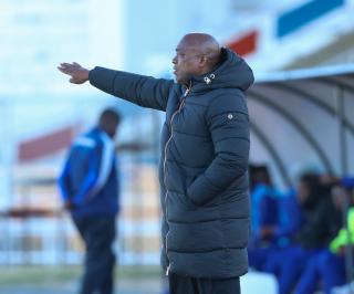 WINDHOEK, 20 June 2026 - UNAM FC head coach Robert Nauseb watches from the touchline during his side's Namibia Football Association (NFA) Cup semi-final match against Okahandja United at the Independence Stadium. UNAM FC won the match 1-0. (Photo by: Hesron Kapanga) NAMPA