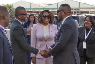 WALVIS BAY, 16 July 2026 - Information and Communication Technology Minister Emma Theofelus looks on as Namibia Ports Authority’s Executive for Commercial Services Elias Mwenyo greets Botswana Vice President Ndaba Gaolathe during his visit to the Botswana Dry port at the port of  Walvis Bay. (Photo: MICT)