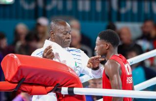 GLASGOW, 26 July 2026 - Coach Albertus Tamaseb inspecting Philip Pumulo Mutakela Haoseb (in red) ahead of his fight against Charif Yaya of Togo during Round of 16 bouts at the Commonwealth Games in Glasgow, Scotland. Haoseb secured victory with a second-round knockout to advance to the quarter-finals. (Photo: Hesron Kapanga) NAMPA
