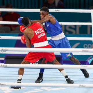 GLASGOW, 28 July 2026 – Namibia's 55kg boxer Philip !Haoseb (in blue) while in action against New Zealand's Alex Mukuka during the semifinals of the Commonwealth Games. !Haoseb won the fight on a split decision. (Photo: Hesron Kapanga) NAMPA
