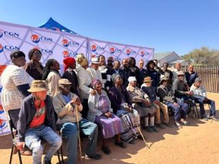 GOBABIS, 04 August 2026 - Governor of the Omaheke Region, Pijoo Nganate flanked by regional councillors, Swakop Uranium’s John Moody and Percy McCallum, and residents of the Epako Old Age Home. (Photo: Contributed) 