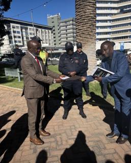 Windhoek, 10 August 2026- Justice ministry Executive Director Audrin Mathe receiving a petition from Matheus Nangolo. (photo contributed). NAMPA