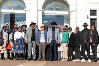 CAPE TOWN, 12  August 2026 – Members of the Namibian delegation outside the Iziko Museum and Planetarium in Cape Town, South Africa. The delegation, comprising government representatives, traditional leaders, surviving veterans, and affected family members, is in South Africa from 06 to 21 August to oversee the exhumation and repatriation of former Namibian political prisoners and liberation heroes who died in exile during the apartheid era. (Photo Contributed: MICT) NAMPA