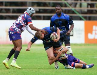 WINDHOEK, 12 September 2026 - Vipers and Keetmanshoop Rams Rugby Clubs players (in blue/dark blue and white, blue and red) while in action during the second semifinals of the Namibia Rugby Union (NRU) First Division championship trophy at the Hage Geingob Stadium. Oranjemund won the match 26-19 to qualify for the final against Vipers. (Photo by: Hesron Kapanga) NAMPA
