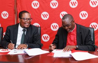 WINDHOEK, 21 October 2026 - Bank Windhoek’s Financial Director, Zenaune Kamberipa and Bishop Dr Gideon Niitenge, Presiding Bishop of the Evangelical Lutheran Church in Namibia and Bishop of the Western Diocese, sign the agreement. (Photo: Contributed) 