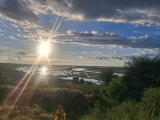 RUNDU, 23 March 2026 - Sunbeams illuminate the riverbanks and floodplains of the Kavango River as day turns to evening. (Photo by: Uakutura kambaekua) NAMPA