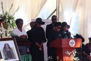 WINDHOEK, 24 October 2024 – Ndapanda Pohamba flanked by four other siblings during the memorial service of their late mother, Penehupifo Pohamba (Photo: Andreas Thomas) NAMPA
